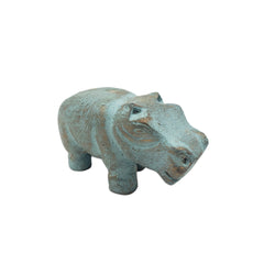 Decorative hippo figure with a textured surface on a white background