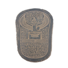 Decorative stone with winged symbol and hieroglyphics on a white background