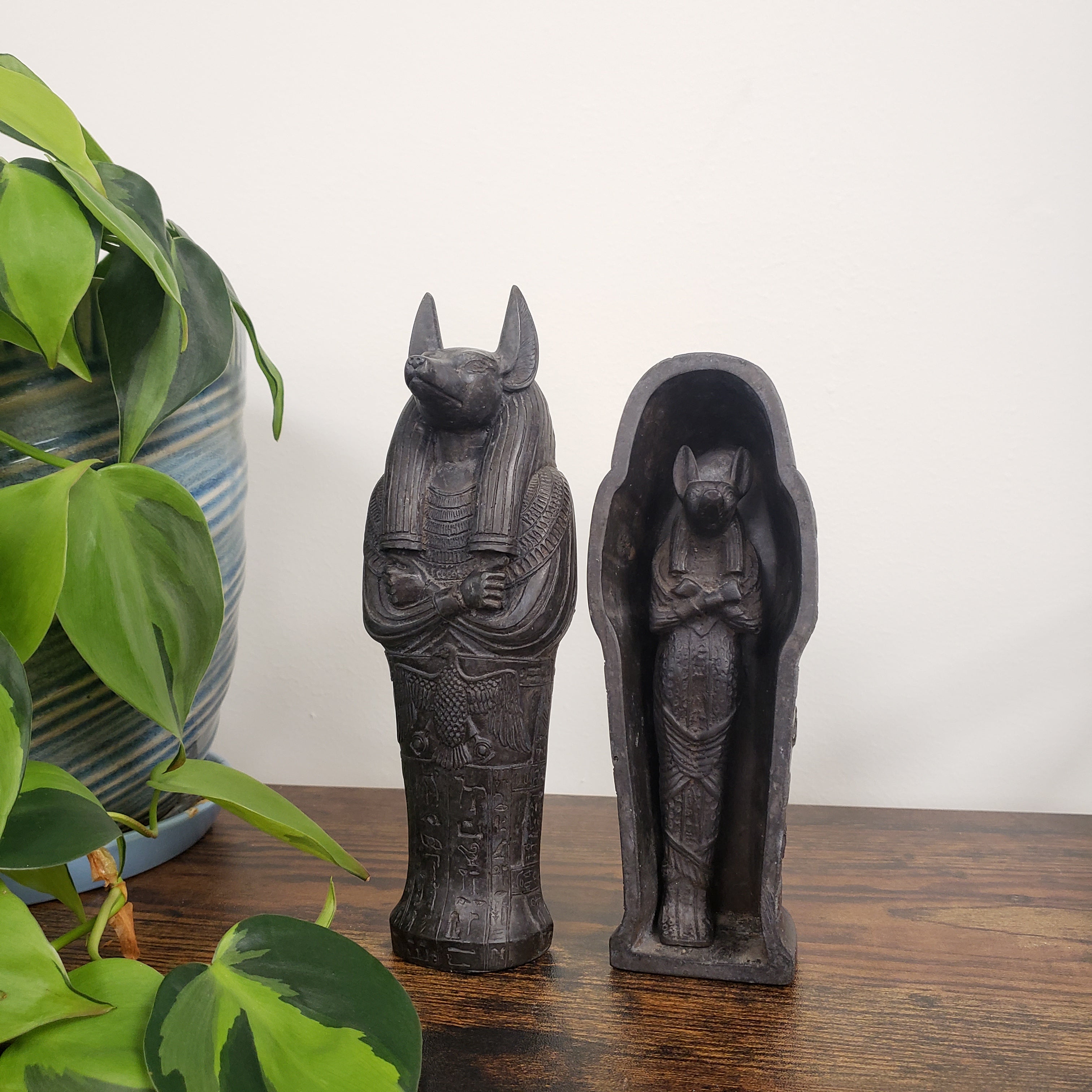 Decorative Anubis on a white wall.