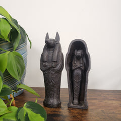 Decorative Anubis on a white wall.