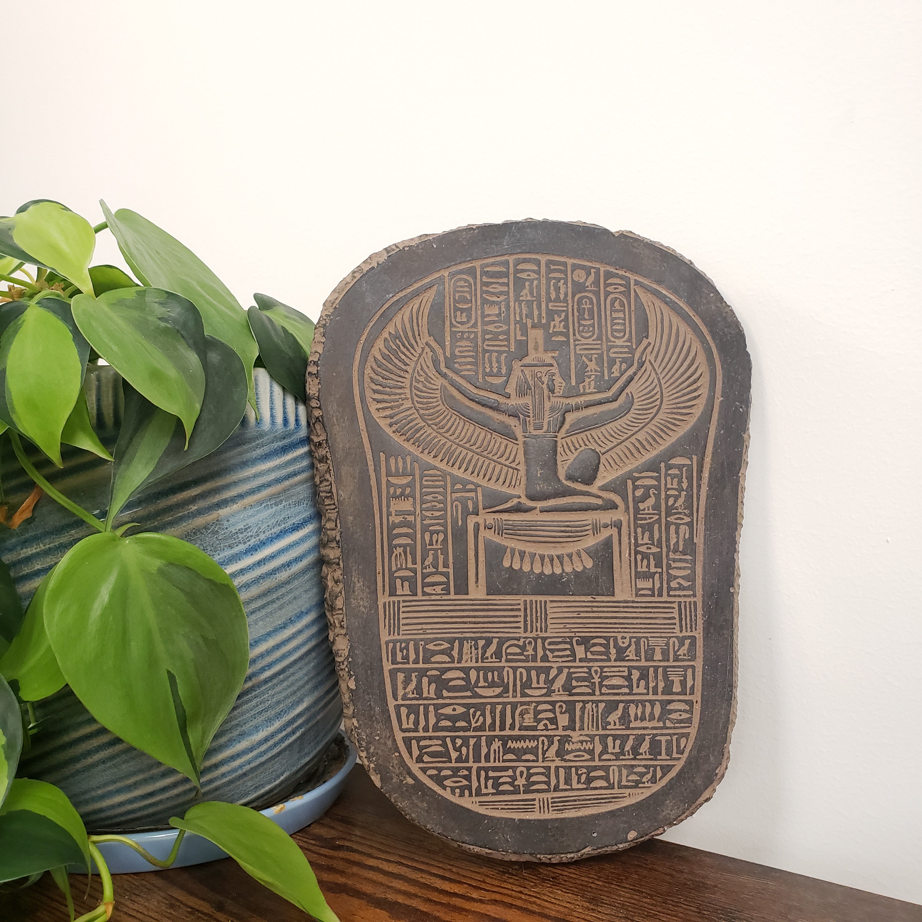 Decorative item with hieroglyphics on a white background