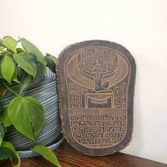 Decorative item with hieroglyphics on a white background