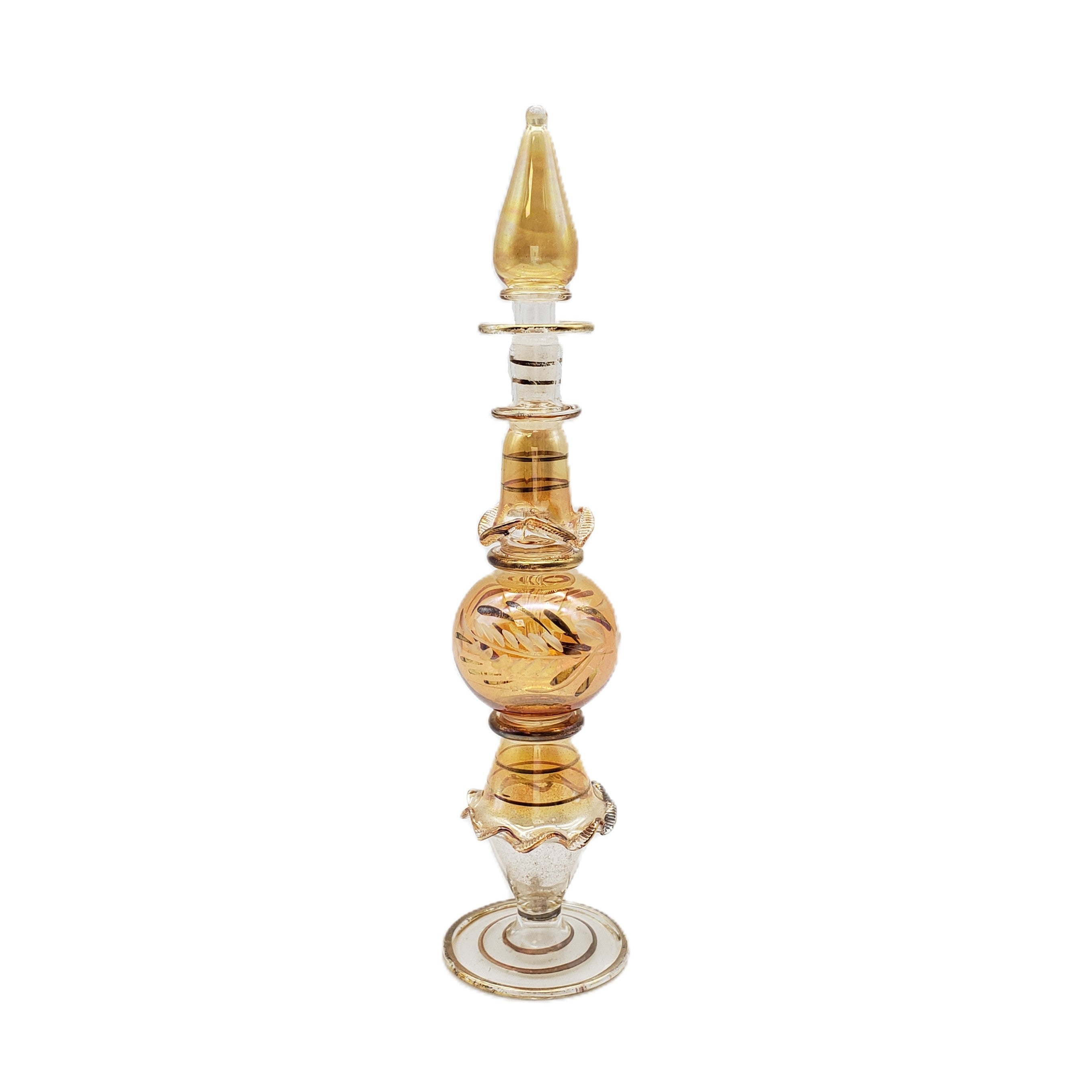 Decorative glass bottle with gold and white design on a white background