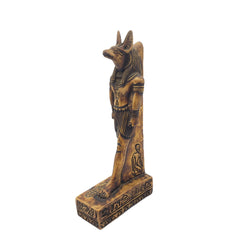 Bronze statue of a Egyptian deity on a white background