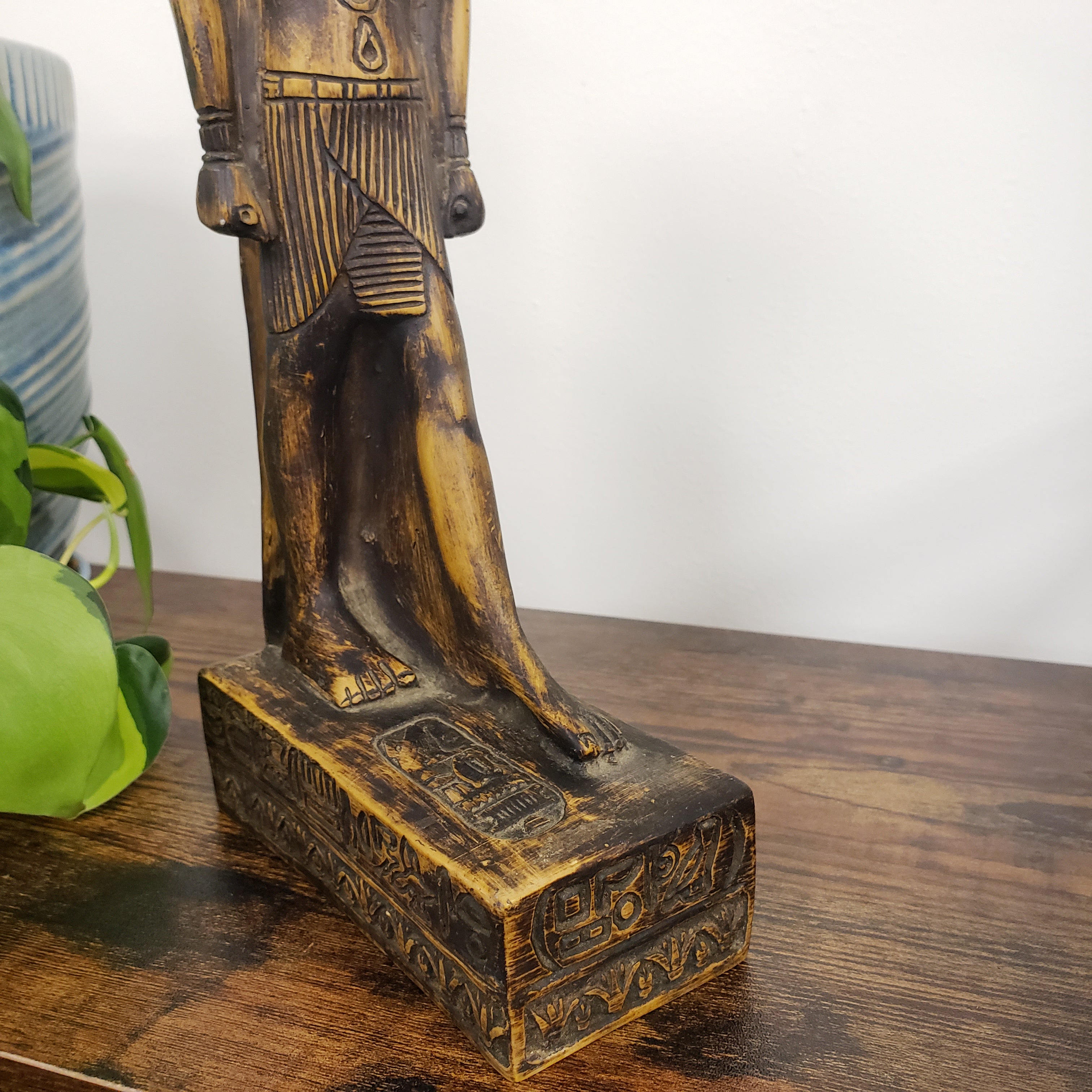 Egyptian god Thoth sculpture with intricate carvings on a white background