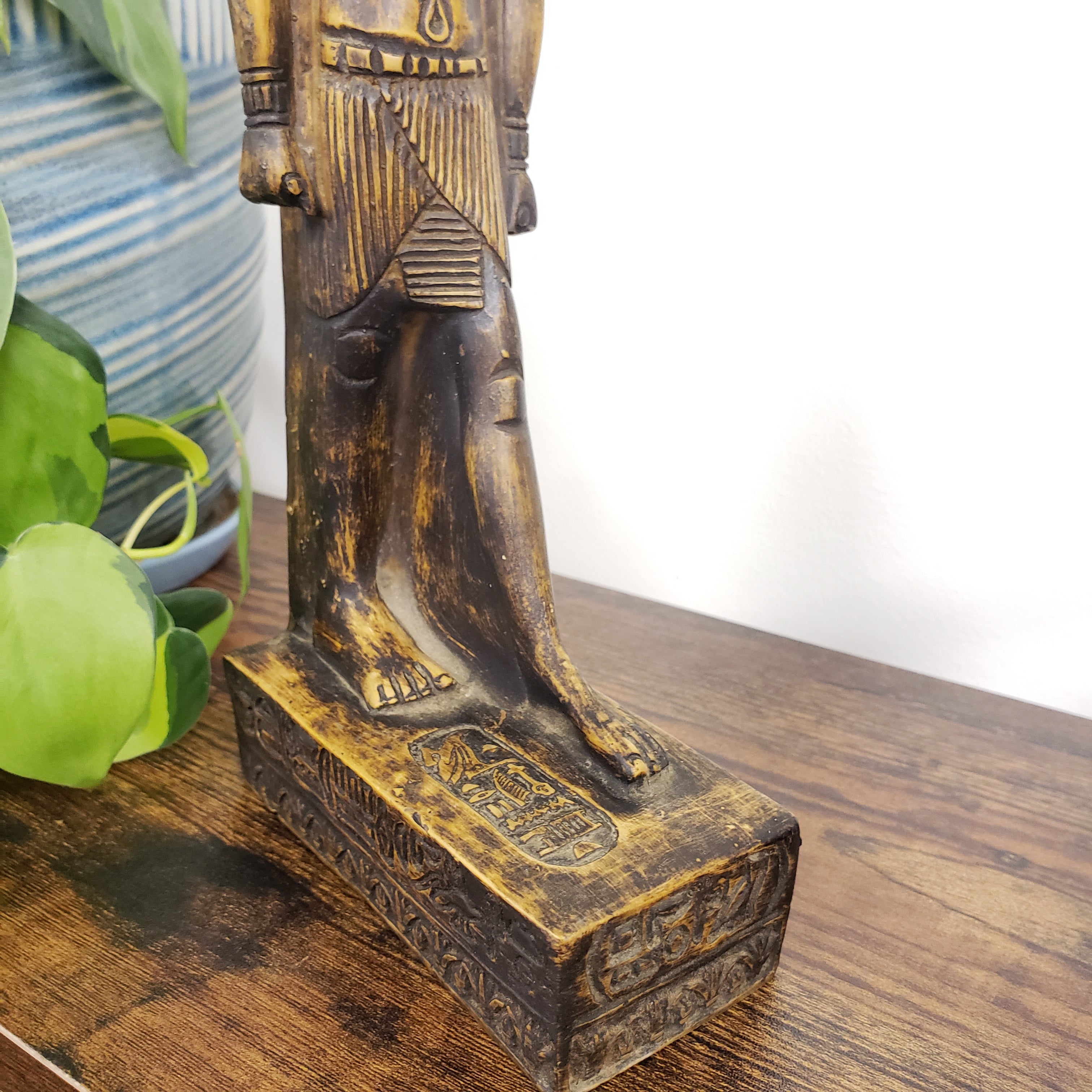 Wooden sculpture with intricate carvings on a wooden surface