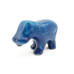 Blue ceramic hippo figurine on a white background