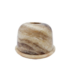 Marble-patterned candle holder on a white background