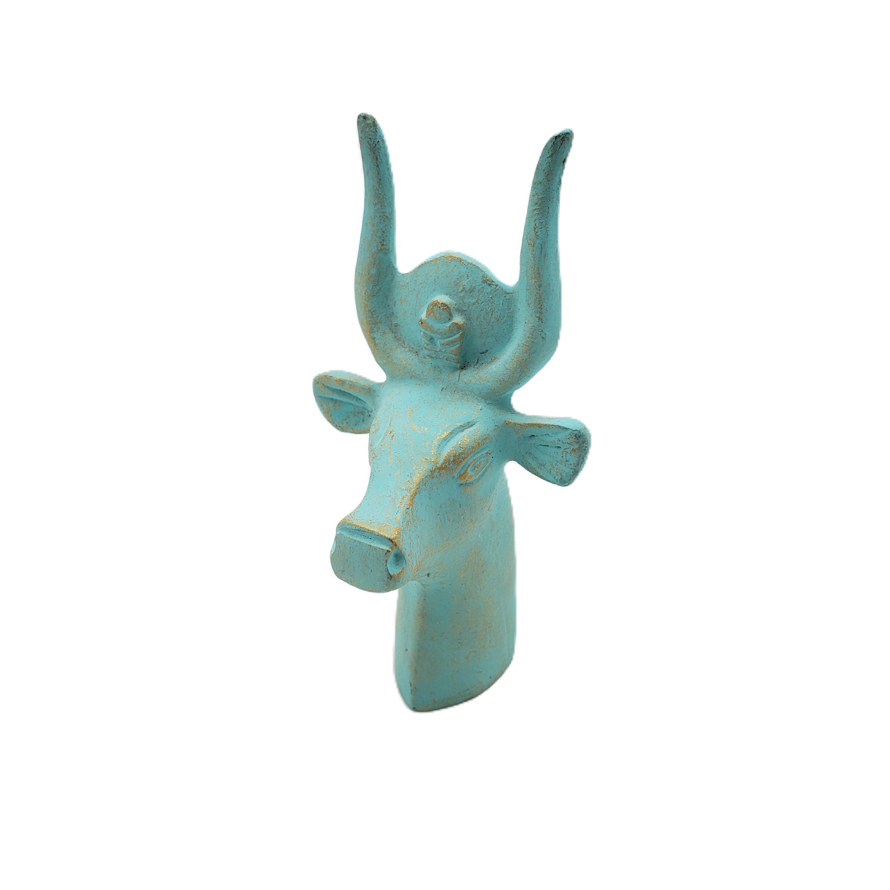 Turquoise bull head sculpture on a white background