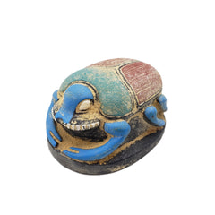 Decorative beetle figure with colorful paint on a white background