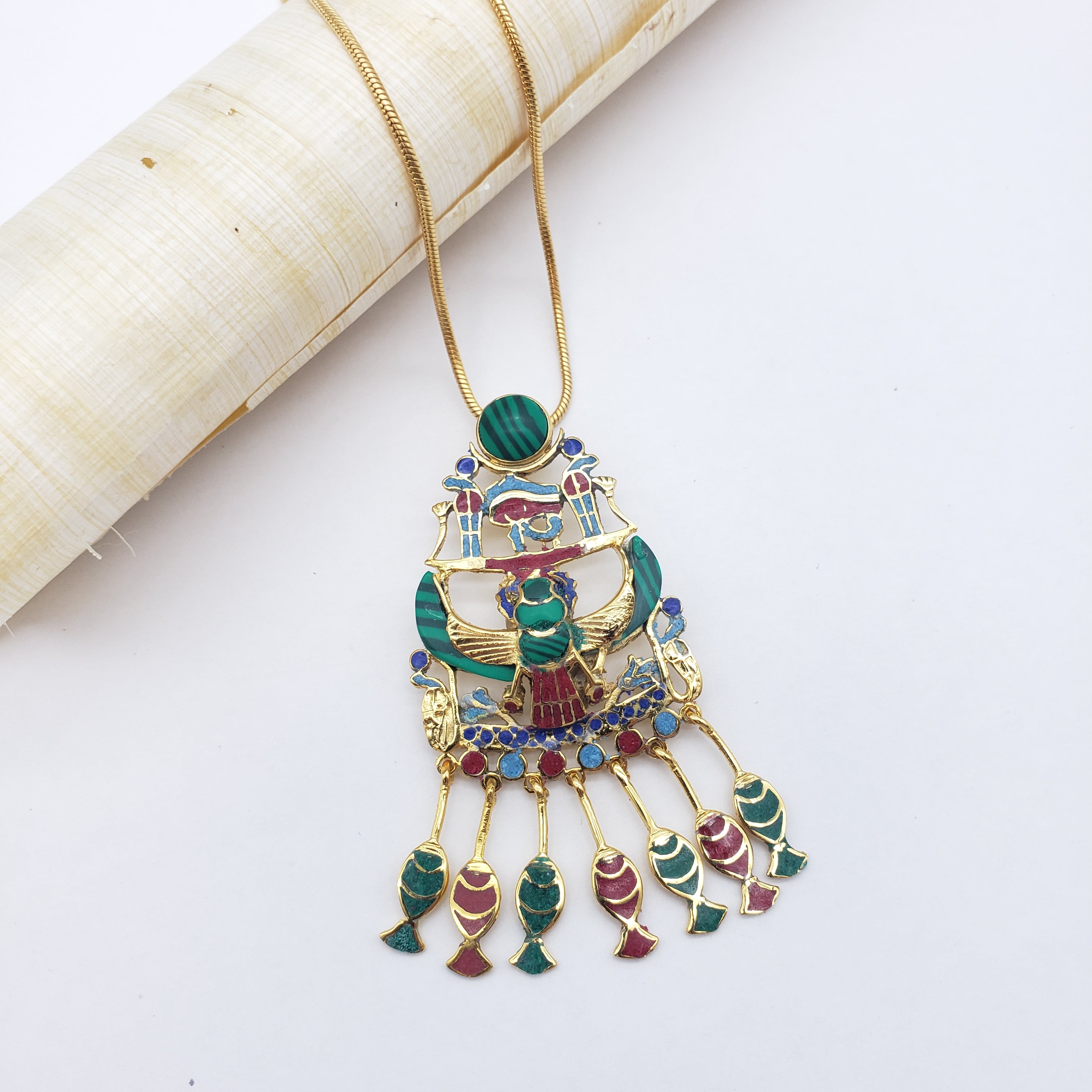 Decorative necklace with multicolored stones on a white background