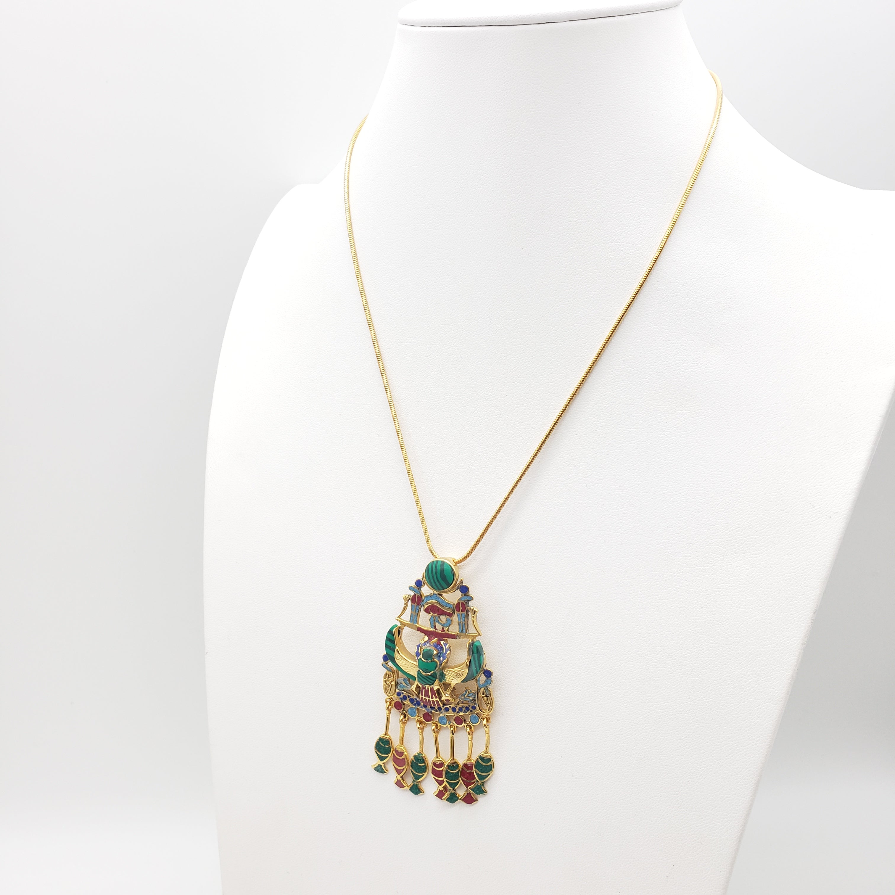 Decorative necklace with intricate design on a white background