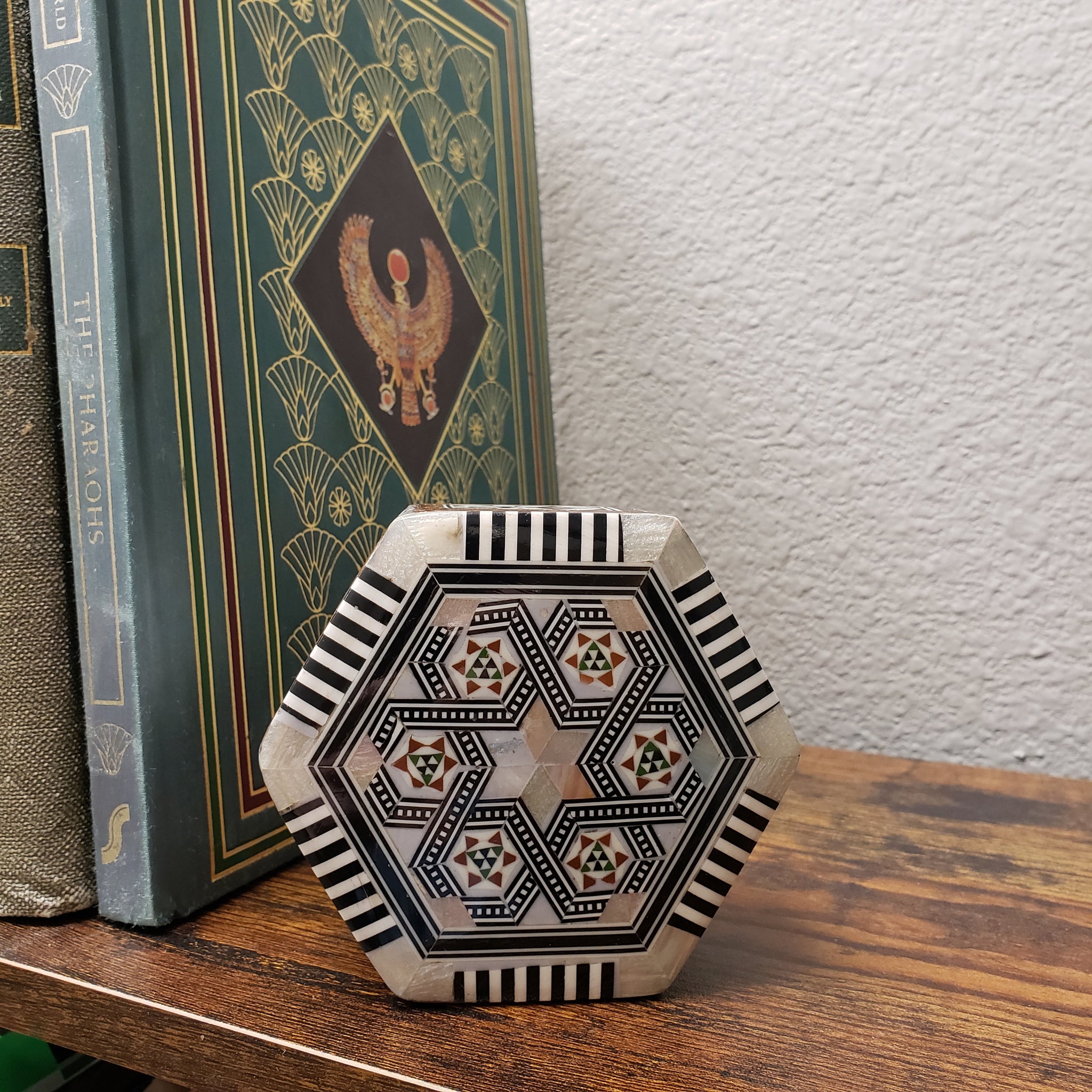 Jewelry box in store hexagonal shape with rich inlays of pearl and noble woods.