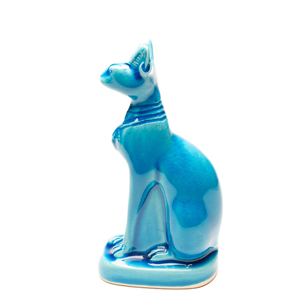 Blue ceramic cat figurine on a white background