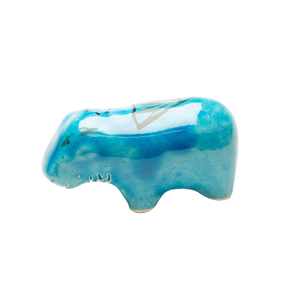 Blue ceramic hippo figurine on a white background