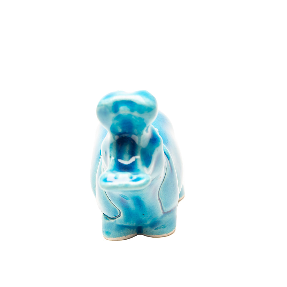 Blue ceramic hippo figurine on a white background