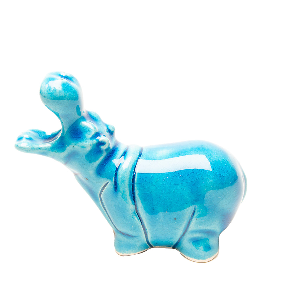 Blue hippo figurine on a white background