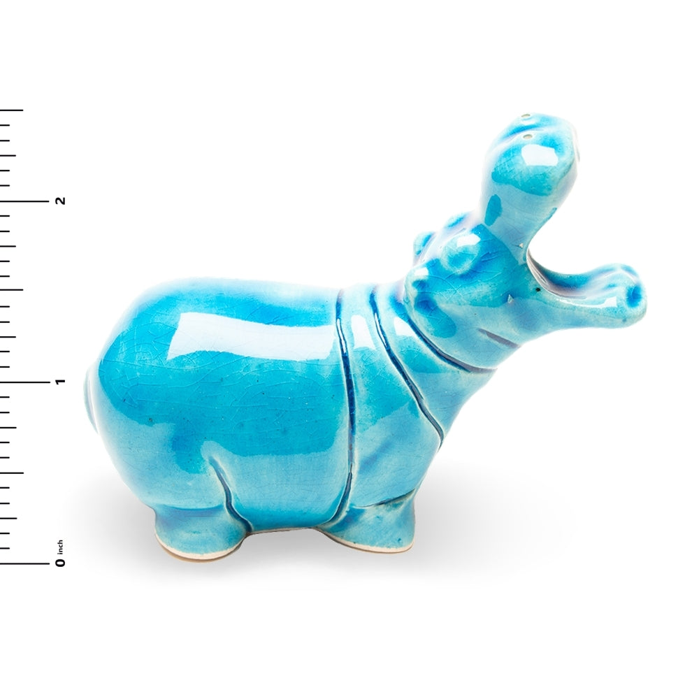 Blue ceramic hippo figurine on a white background with a ruler for scale.