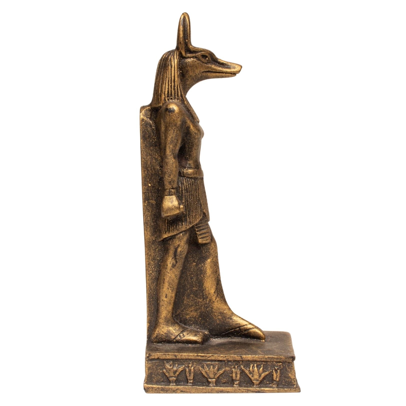 A small bronze-finished figurine of an Egyptian canine-headed deity standing on a rectangular base with hieroglyphic details, isolated on a white background.