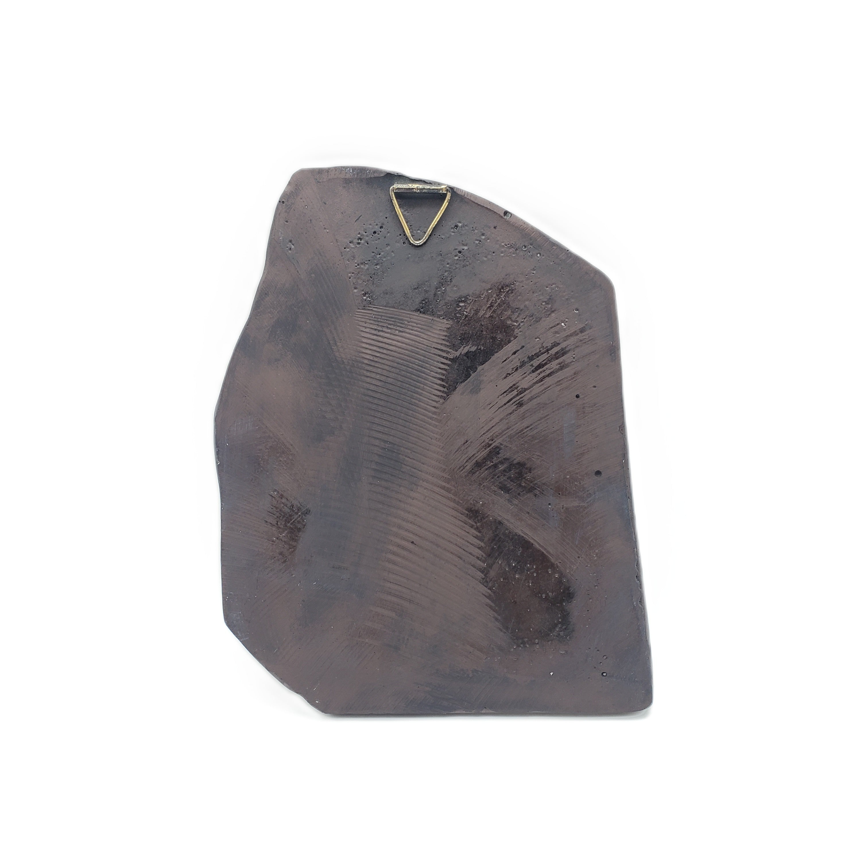 Decorative stone with a gold triangle on a white background