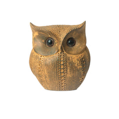Decorative gold owl sculpture on a white background