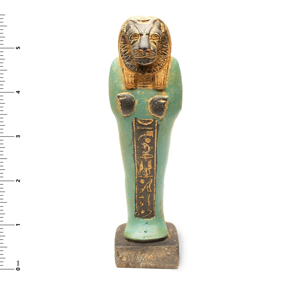 Decorative object with a gold lion head and green body on a white background