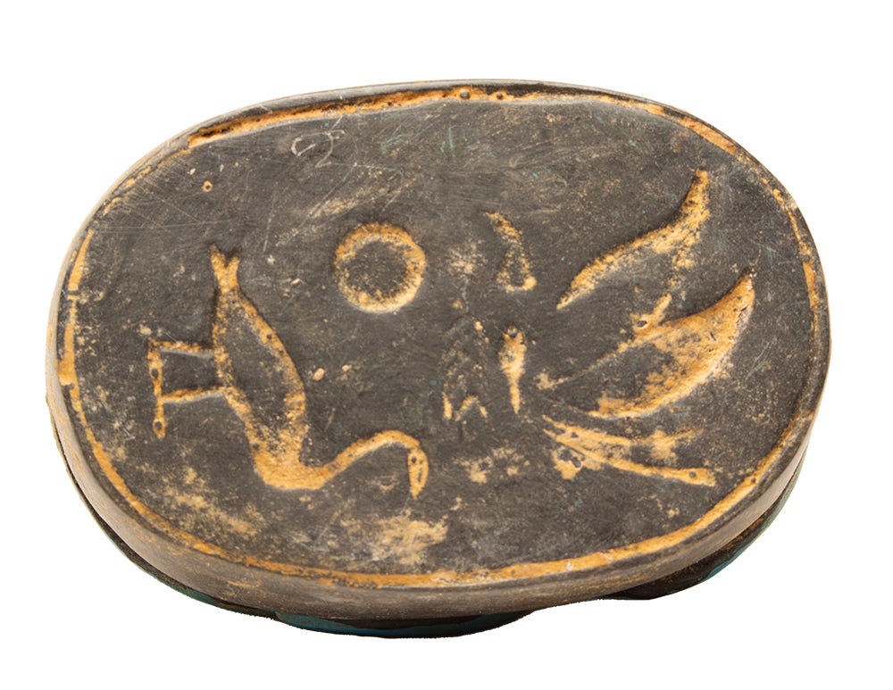 Bronze or copper coin with engraved design on a white background