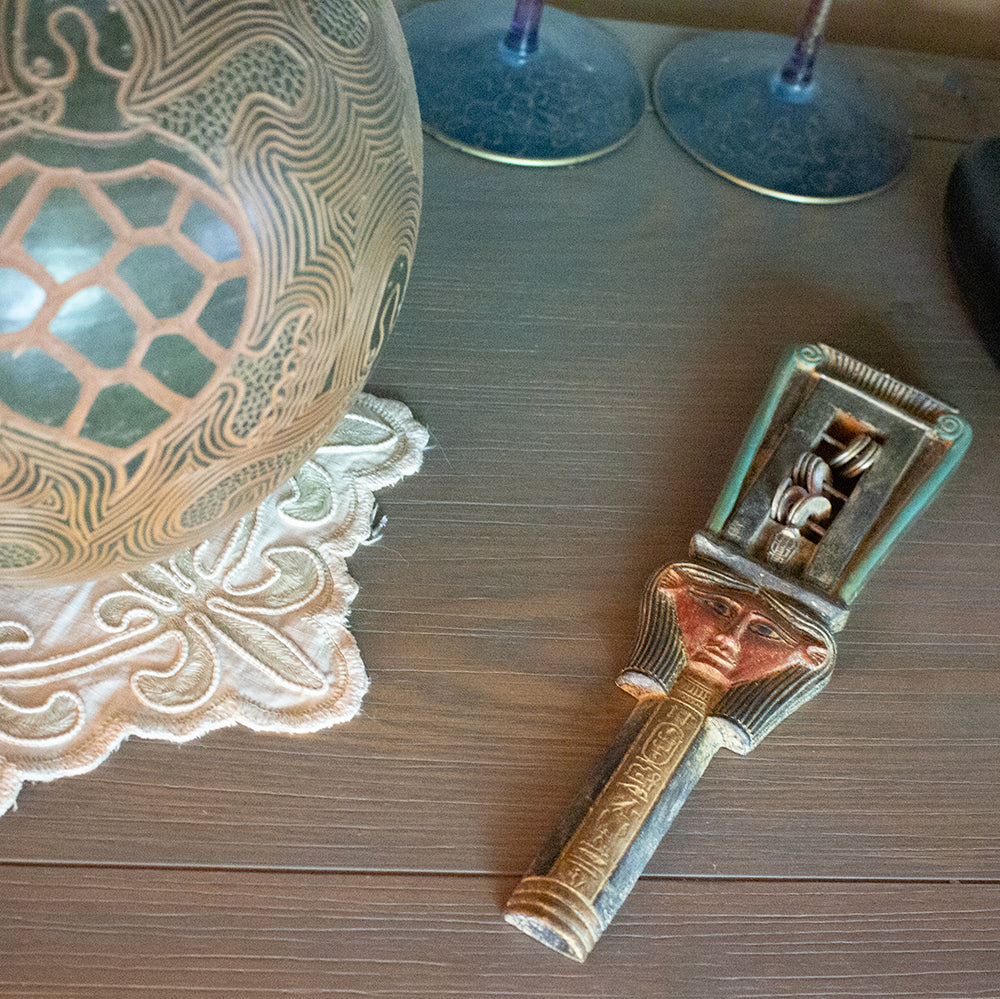 Decorative object with intricate design on a wooden surface