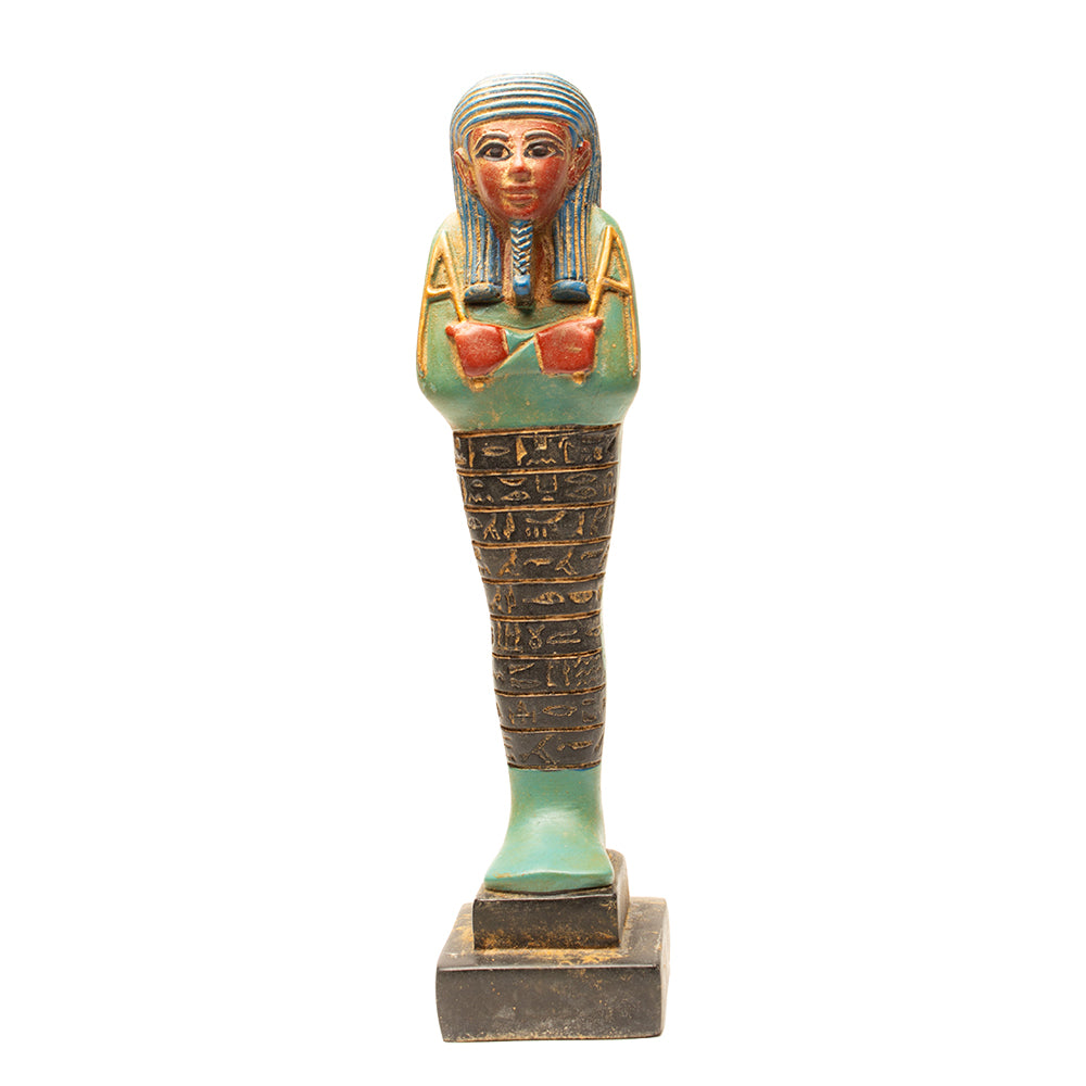 Decorative figurine resembling an ancient Egyptian deben on a white background