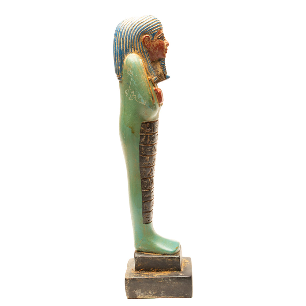 Ancient Egyptian sarcophagus figure on a white background