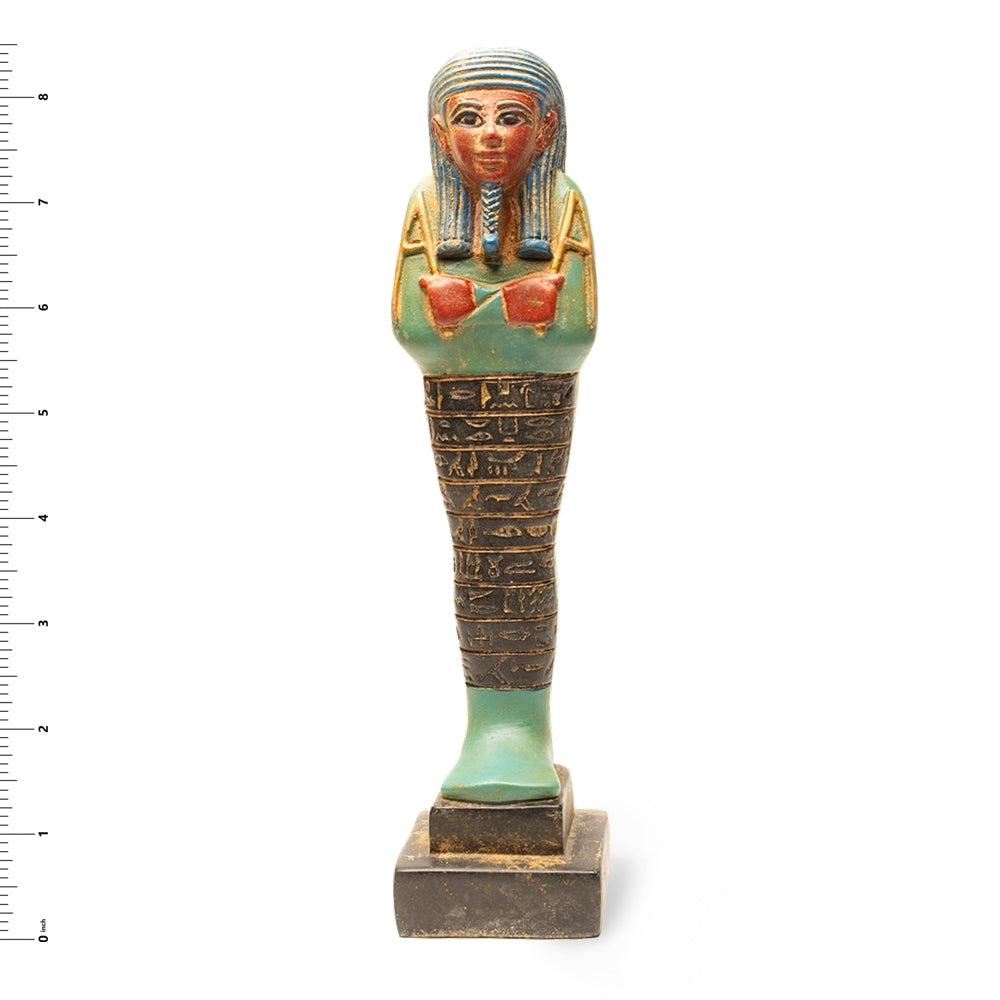 Decorative Egyptian-style figurine with hieroglyphics on a white background