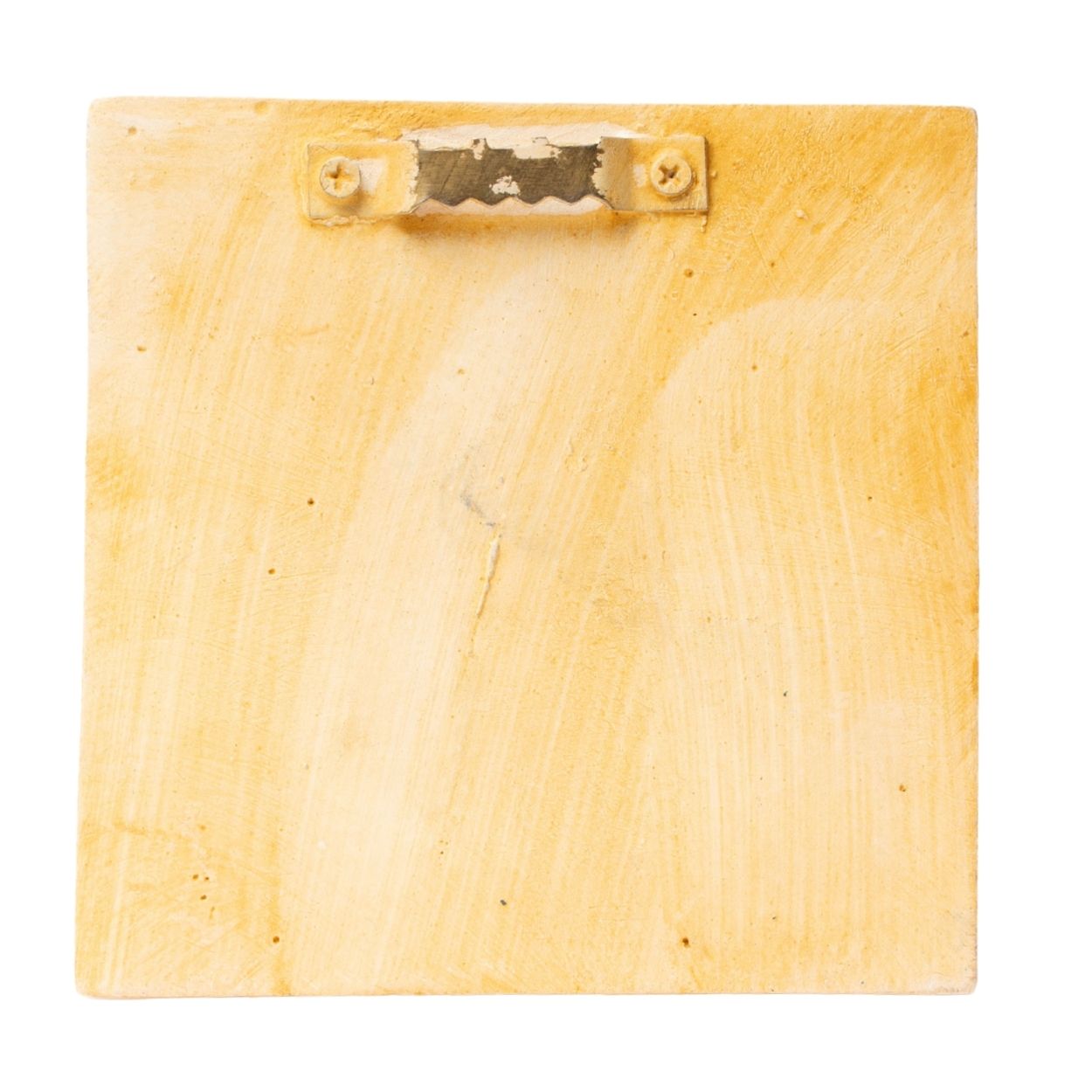 back of a plaque with a sawtooth hanger on a white background