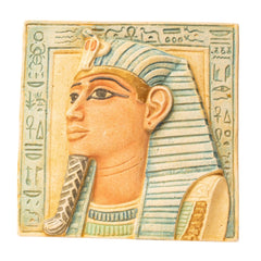 Decorative tile with an Egyptian pharaoh design featuring hieroglyphs.