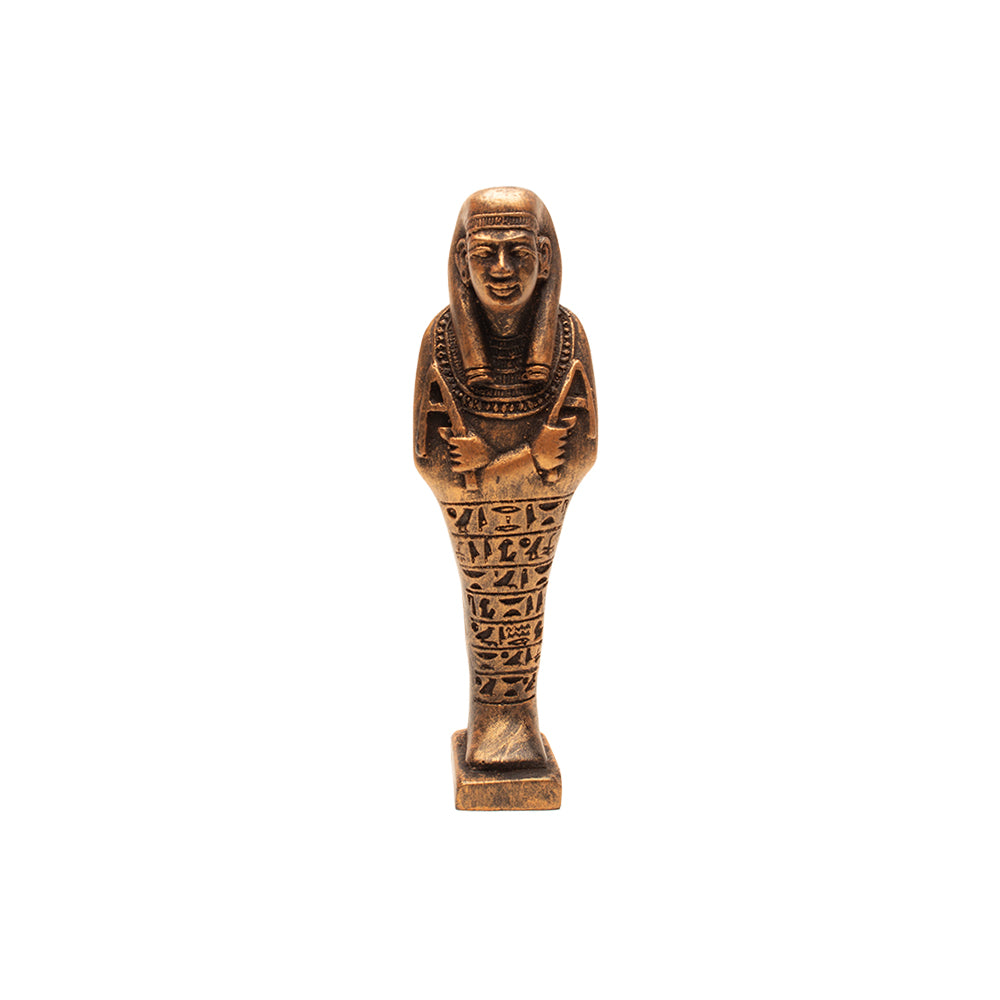 Bronze-colored Egyptian-style figurine on a white background