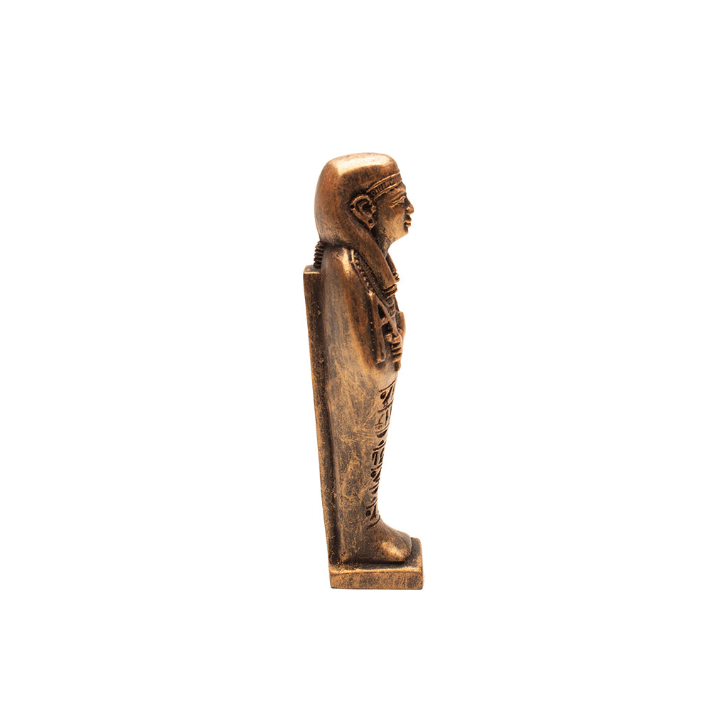 Bronze sarcophagus figurine on a white background