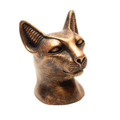 Bronze statue of a cat head on a white background