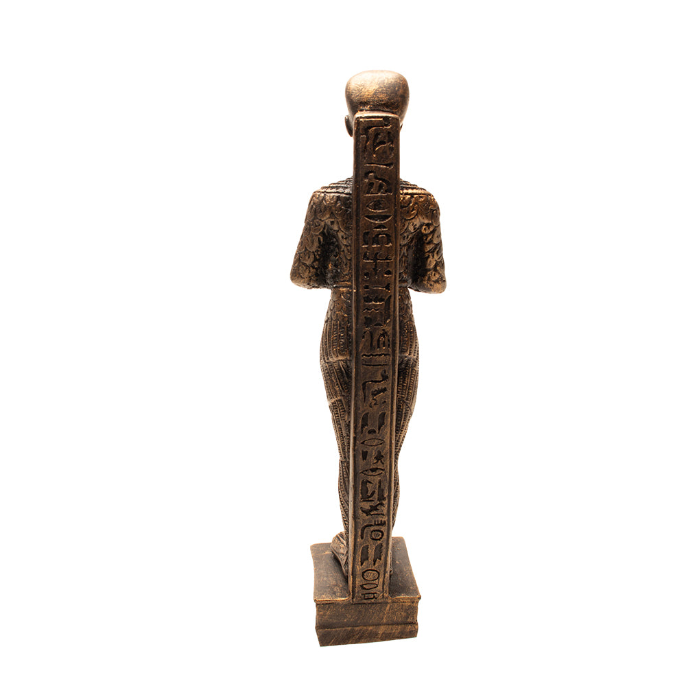 Bronze statue of a figure with hieroglyphics on a white background