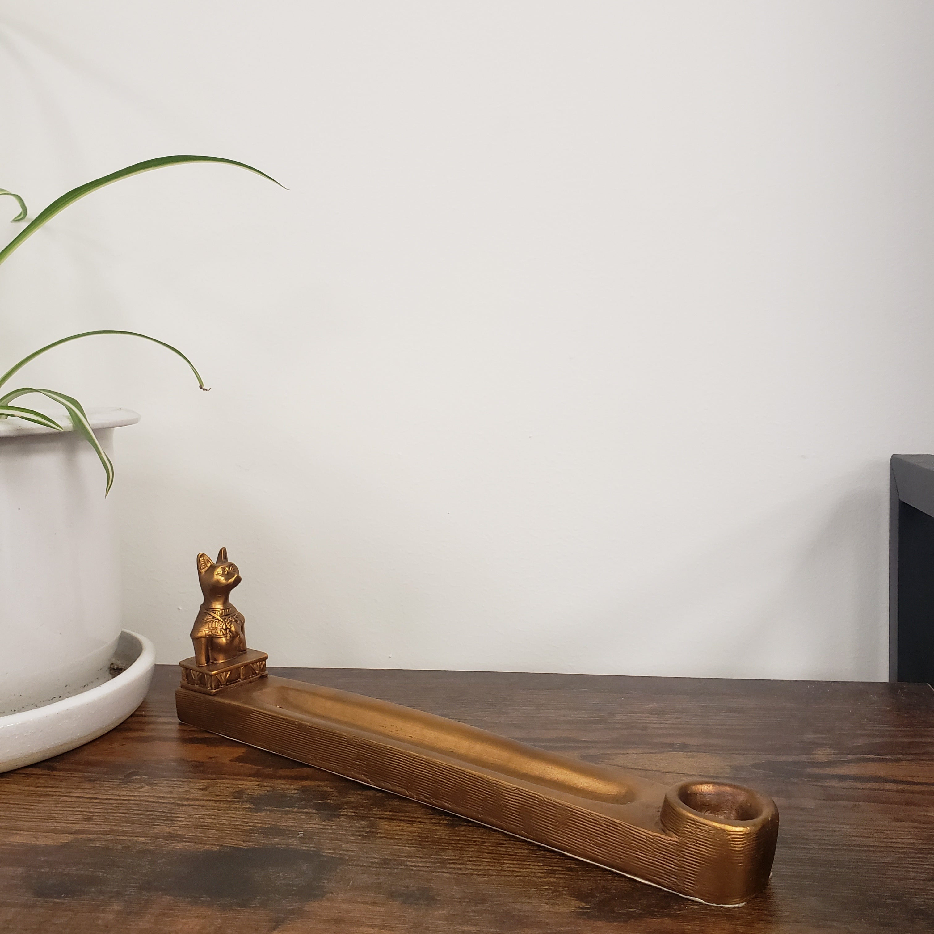 incense holder with a cat design on a white background