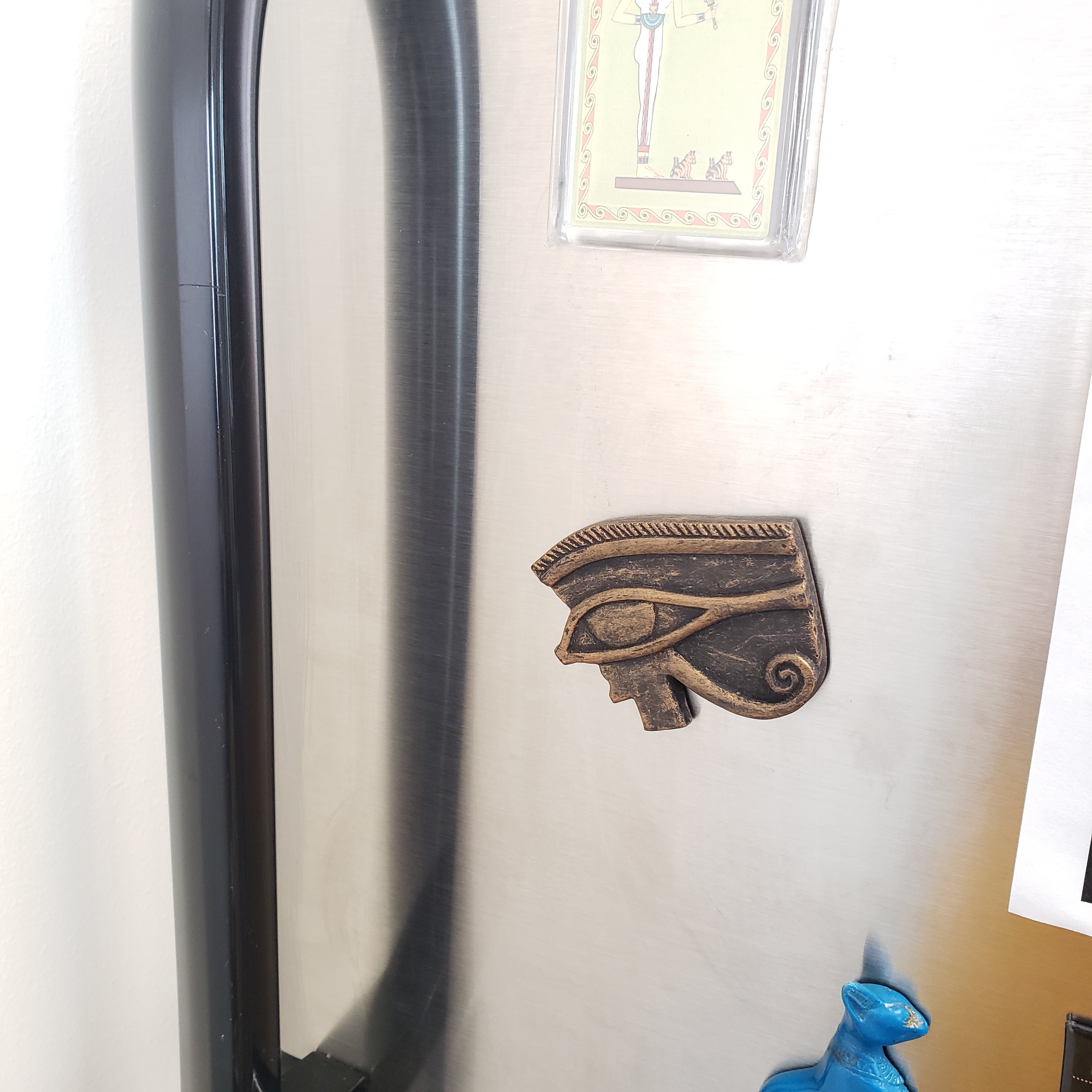 Decorative metal emblem on a refrigerator 