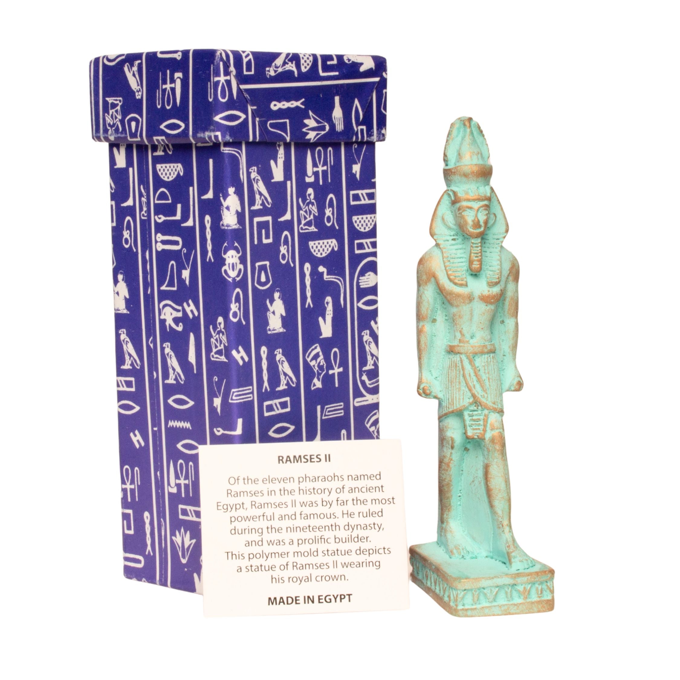 A Ramses II Egyptian pharaoh statue in a weathered turquoise-green finish stands next to its blue and white patterned gift box with a descriptive card on a white background.