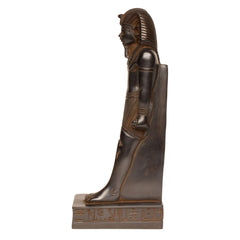 An Egyptian pharaoh statue in a dark bronze finish, standing on a rectangular base with hieroglyphic details, isolated on a white background.