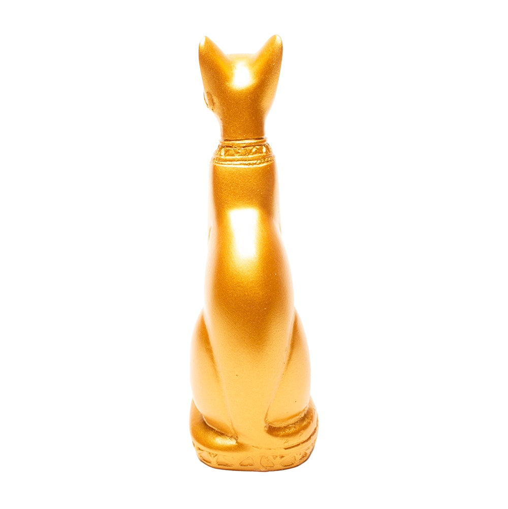 Gold cat-shaped object on a white background