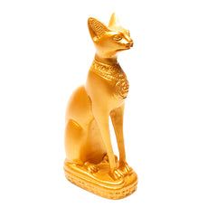 Gold Egyptian cat statue on a white background