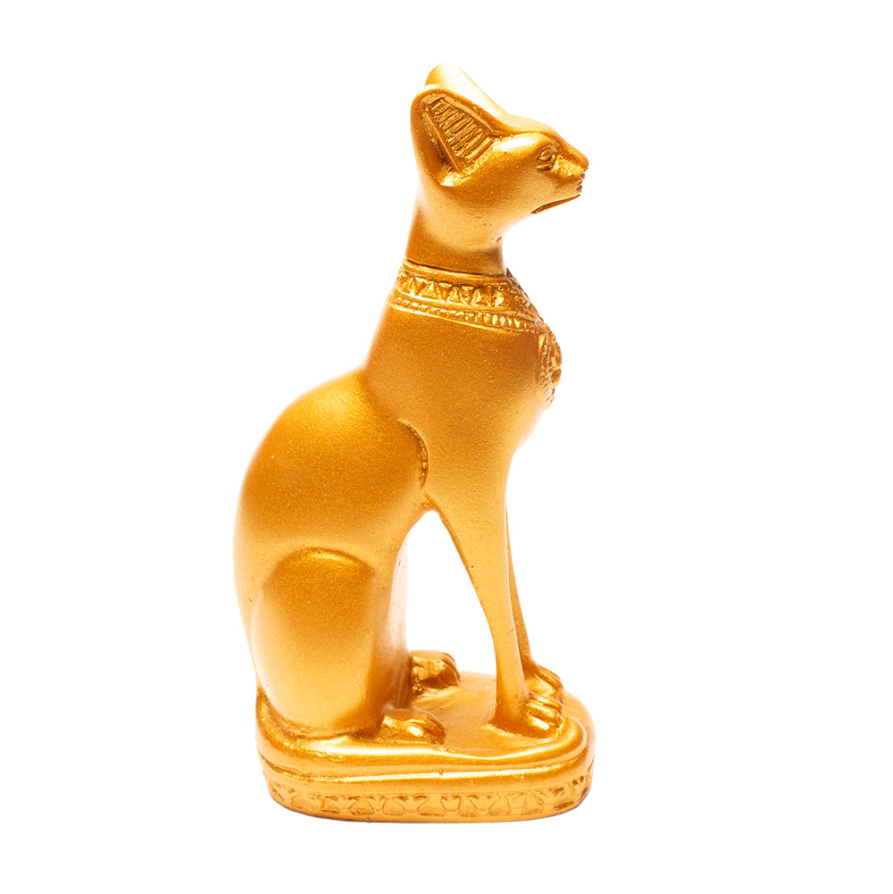 Gold cat figurine with decorative elements on a white background