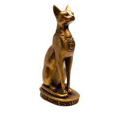 Bronze cat statue with a necklace on a white background