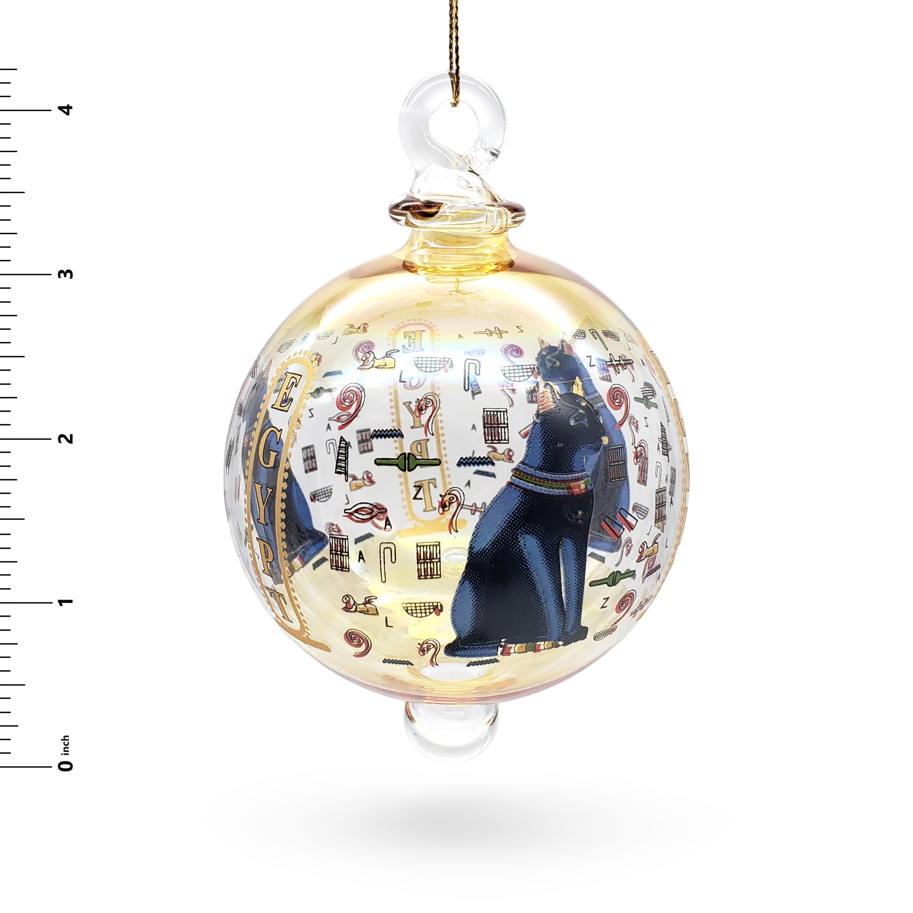 Decorative glass ball ornament with Egyptian-themed design on a white background