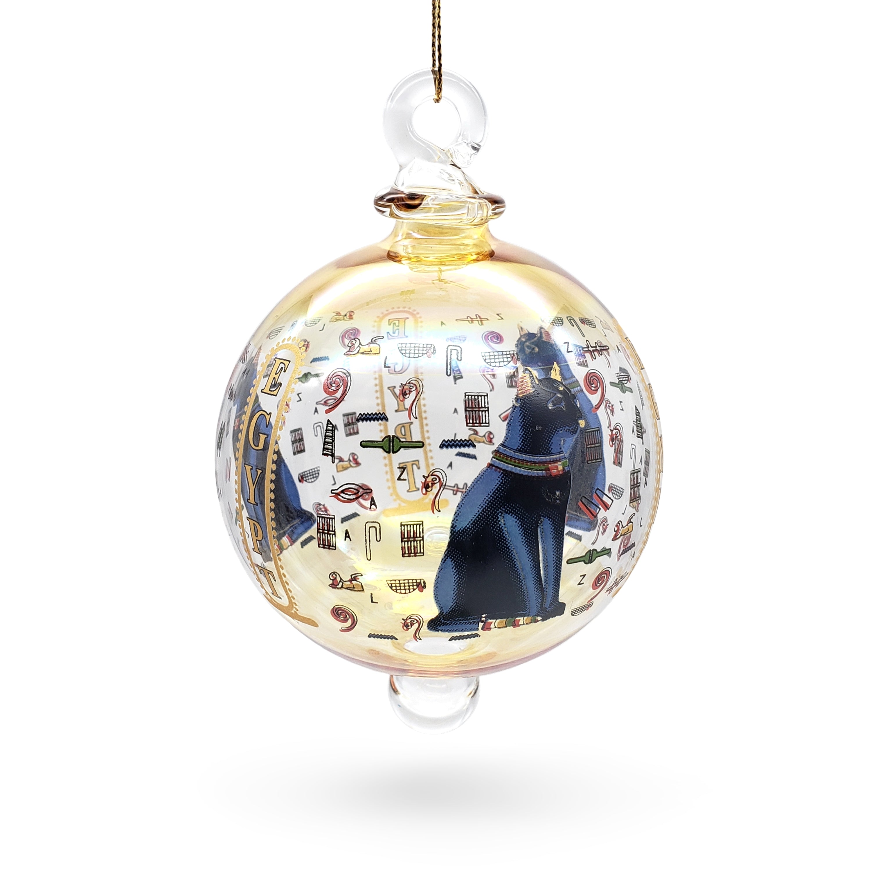 Decorative glass ball ornament with Egyptian-themed design on a white background