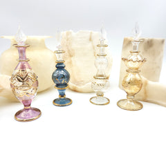 Set of decorative glass bottles with a neutral background