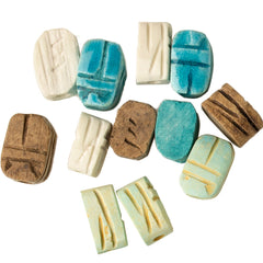 Collection of decorative scarabs with various colors and patterns on a white background