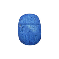 Blue stone with hieroglyphic carvings on a white background